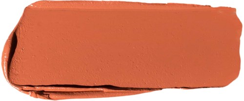 Een streep in oranje of terracotta kleur make-up of lippenstift op een oppervlak.