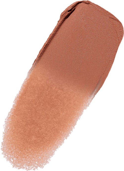 Een beige make-upstift met een ronde, platte top, gedeeltelijk gebruikt en wat poeder verspreid.