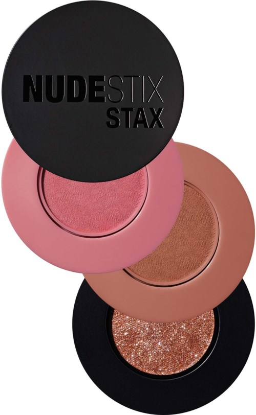 Neljä pyöreää meikkipakkausta pinossa, musta, pinkki, beige ja glitterpinta.