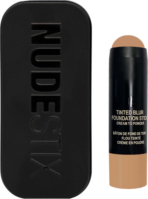 Een zwarte make-up doos met 'XESTEST' en een beige stick- foundational met zwarte dop en tekst.