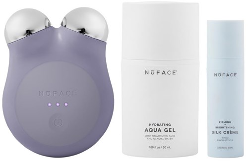 A purple device with two metal balls on top, plus white skincare bottles labeled 'Hydrating Aqua Gel' and 'Firming Skin Crème.'