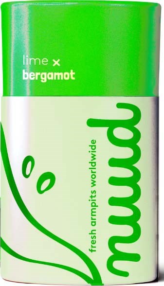 Vihreä ja valkoinen pyöreä purkki, jossa Mango-tarra ja limetin bergamotin tuoksu, pehmeä hedelmäkuva.