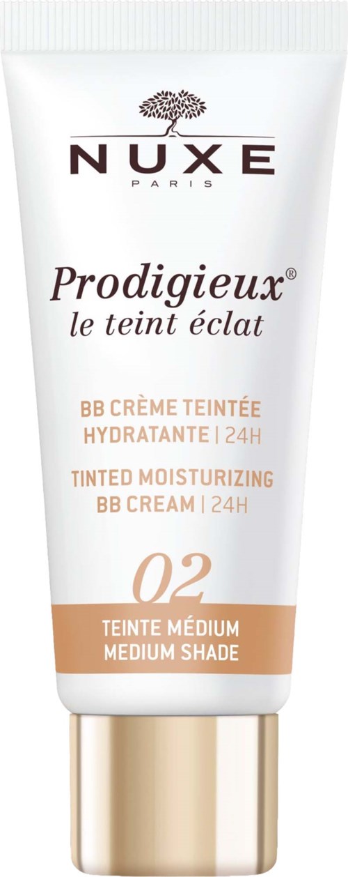 En hvit tube med NUXE Prodigieux BB Cream med beige etikett og gullhette, merket som medium skjerm.