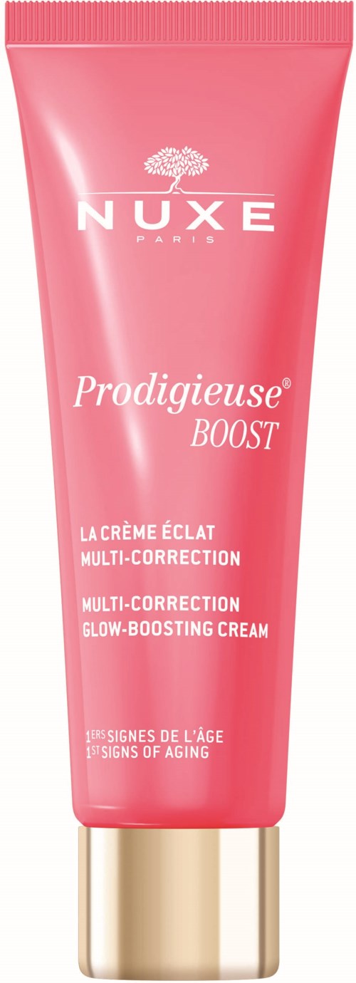 Pink tube of NUXE Prodigieuse Boost glow-boosting face cream with a gold cap, labeled for multi-correction and aging signs.