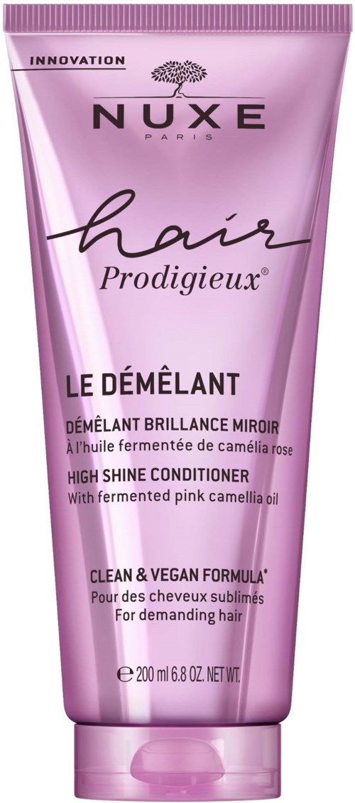 Roze haarcrème buis met zwarte en paarse tekst, merknaam NUXE, bevordert glanzend, gezond haar.
