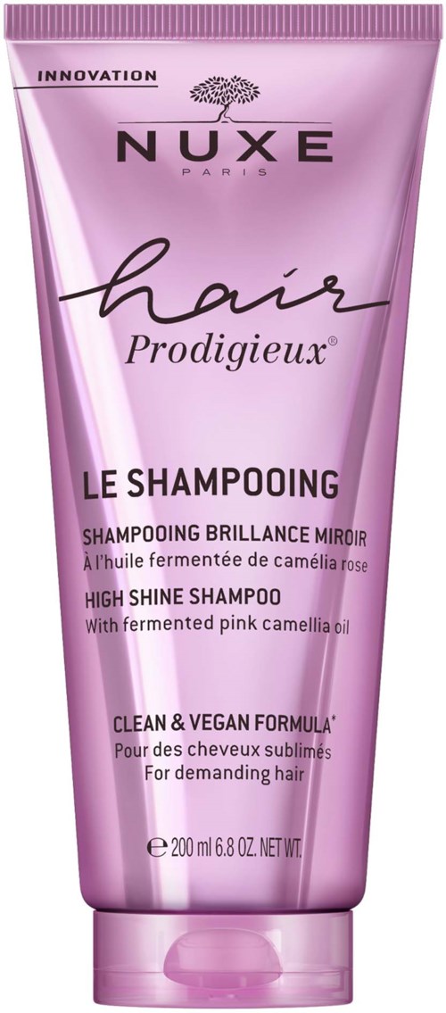 Pink shampoo tube labeled 'Nuxe hair Prodigieux', high shine, with camellia oil, 200 ml, for beautiful hair.