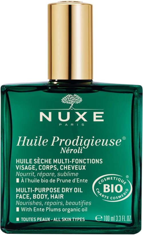En grön flaska med guldkork, märkt NUXE Huile Prodigieuse Neroli, för ansikte, kropp och hår.