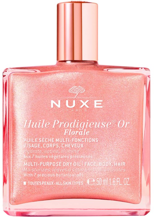 A pink bottle with a shiny cap, labeled NUXE Huile Prodigieuse Or, for face, body, and hair care.