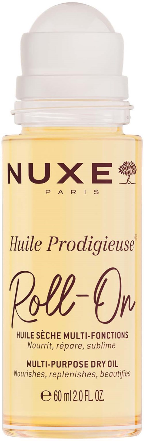 A small bottle of NUXE Paris dry oil with a white cap, yellow liquid inside, and black and purple text on the label.