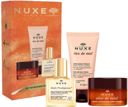 Set med Nuxe Réve de Miel hudvårdsprodukter med handkräm, läppbalsam, ansiktsolja och presentask.