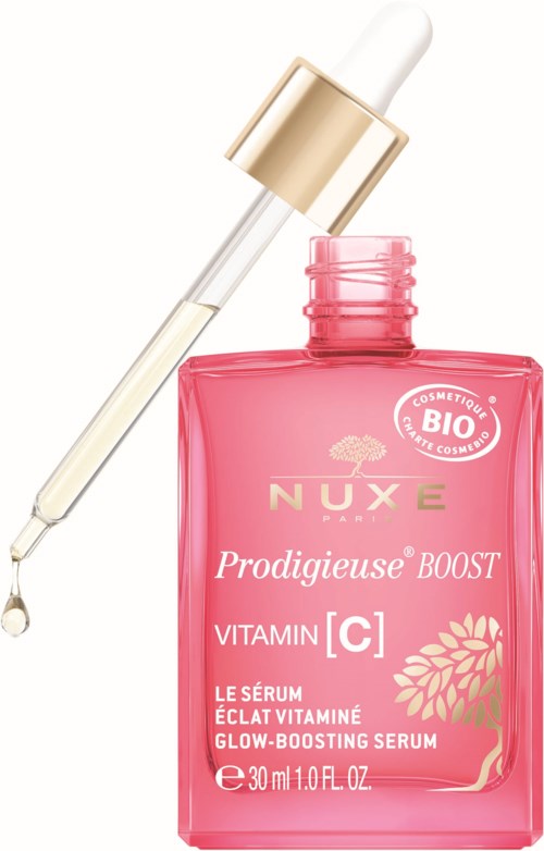 Pink bottle with a dropper, labeled NUXE Prodigieuse Boost, containing vitamin C glow serum.