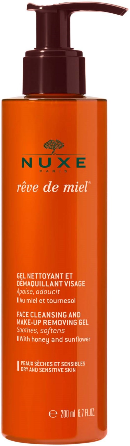 Een lange oranje fles met pomp, voor gezicht reinigen en make-up verwijderen, met honing en zonnebloem.