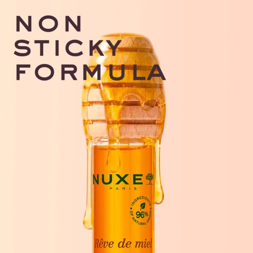 En honeyburk med honung som rinner ner, omgiven av text om icke-klibbig formula och naturliga ingredienser.