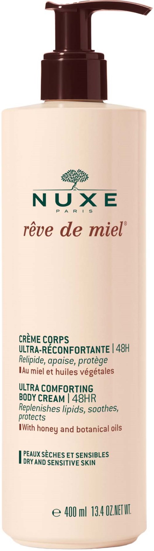 Nuxe-kroppscremeflaska med pump, etikett på franska och engelska, för torr hud, innehåller honung och botaniska oljor.