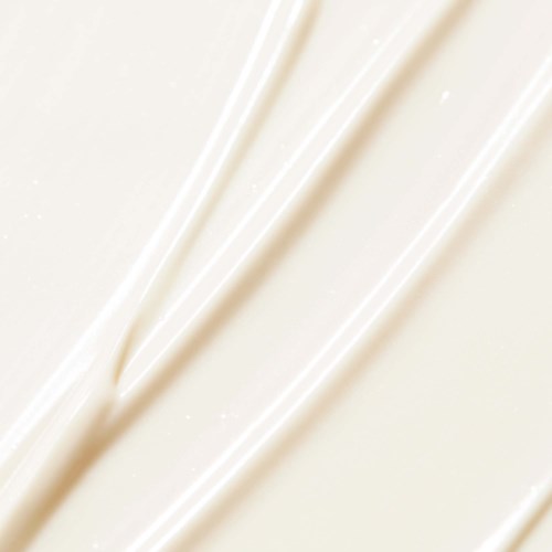 Flera vita linjer på en ljus bakgrund, möjligen grädde eller frosting.