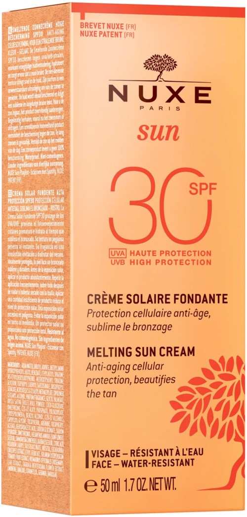 Nuxe Paris sun protection cream with SPF 30, anti-aging, moisturizing, and water-resistant, in a peach-colored tube with orange leaf design.