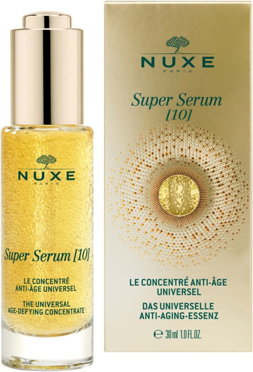 A yellow serum bottle with a silver cap next to a gold box, both labeled NUXE Super Serum 10, anti-aging product.