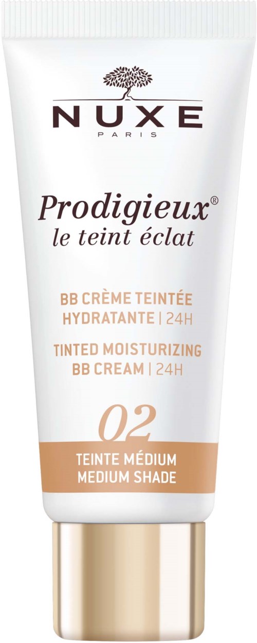 Eine weiße Tube Nuxe Prodigieux BB Creme für mittleren Hautton mit goldener Kappe und Markenlogo. Bietet 24-Stunden-Hydratation.