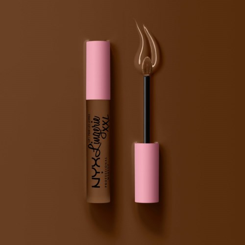 A lipstick tube labeled 'NYX Lingerie XXl' with the cap off and a lit matchstick nearby.
