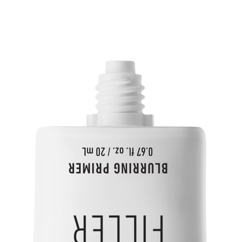 A white tube with black text:"Blurring Primer" and instructions, with a small opening at the top for dispensing.