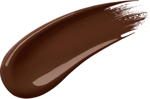 En tjock streck av brun flytande makeup eller kräm med glansigt utseende och avsmalnande kanter.