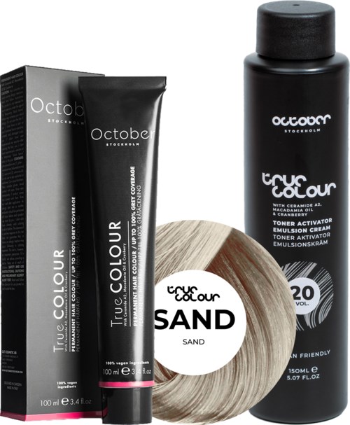 Hair coloring products, including a tube of color, a bottle, and a hair sample circle labeled 'sand' with 20 volume.