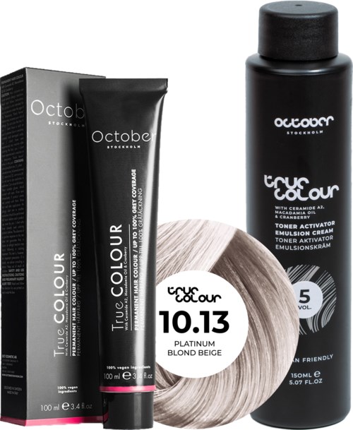 Black hair coloring and toner products from October Stockholm, including a box, tube, and bottle, designed for hair coloring.