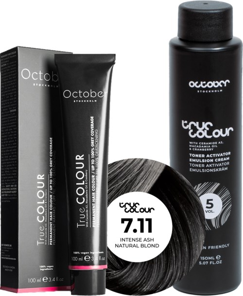 Black hair dye tube, bottle, and packaging with white and pink text and logo, indicating hair color product.