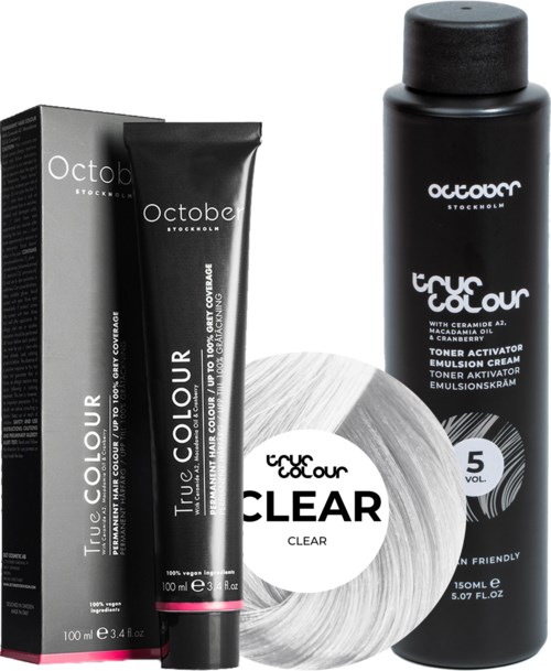 A hair dye kit includes a black bottle, a black tube, a box, and a round hair color application wheel.