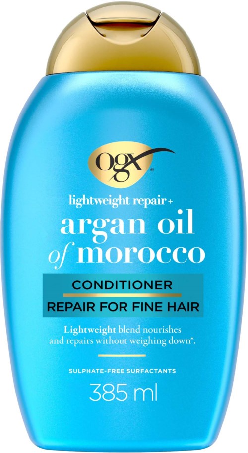 Blå flaska med argan olja balsam för tunt hår, med guldlock och etikett som betonar lätt viktreparation.