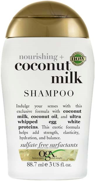 Flesje voedende kokosmelkshampoo met gouden dop en wit label, met tekst dat het sulfaatvrij is.