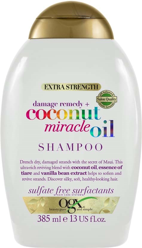 Witte shampoo fles met gouden dop, kleurrijke tekst en beschrijvingen over kokosolie en sulfaatvrije reinigers.