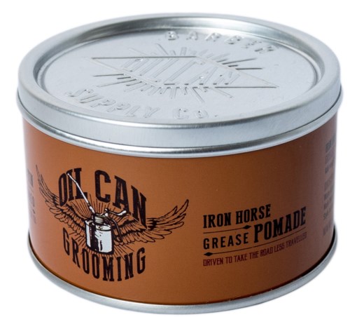 A round metal tin with a brown label, features a logo with wings, a nail, and text: 'IN CAN GROOMING,' advising use.