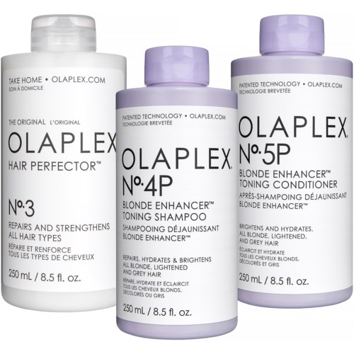 Drie flessen haarverzorgingsproducten van Olaplex, voor blondines, met verschillende nummers en functies, naast elkaar.