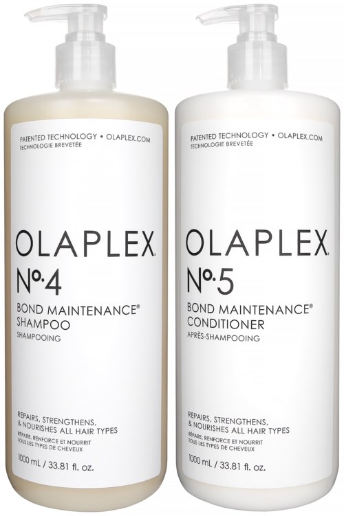 Twee flessen Olaplex haarproducten, No. 4 shampoo en No. 5 conditioner, allebei met pomp.