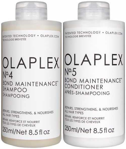 Twee witte flessen Olaplex haarverzorgingsproducten, gemarkeerd No.4 shampoo en No.5 conditioner, elk 250 ml.