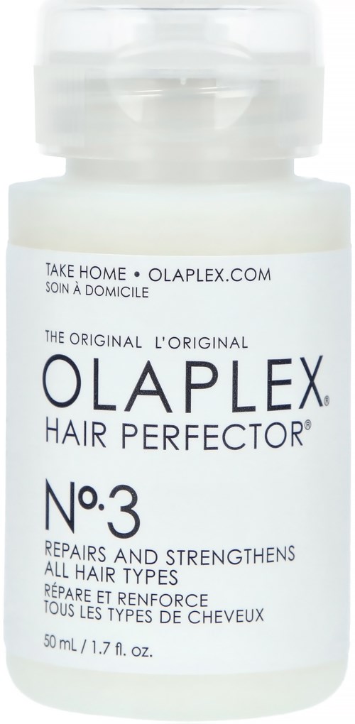 En vit flaska märkt Olaplex No.3, används för att reparera och stärka alla hårtyper.