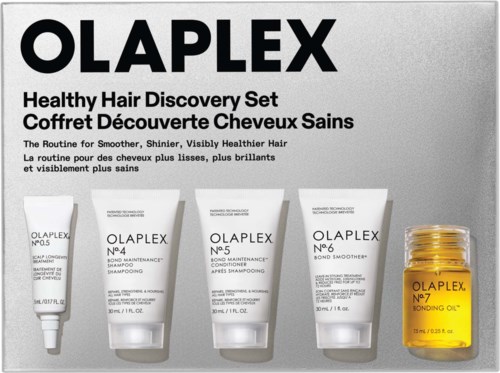 Olaplex haarverzorgingsset met vier tubes en een klein potje, voor glanzend, gezond haar.