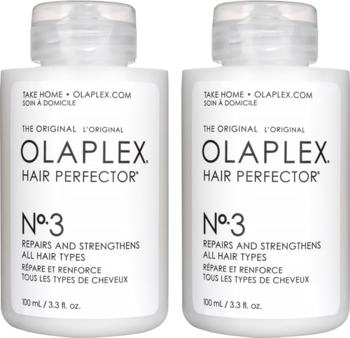 To flasker Olaplex No.3 Hair Perfector er vist, laget for å reparere og styrke håret. Hvit flasker med svart tekst.