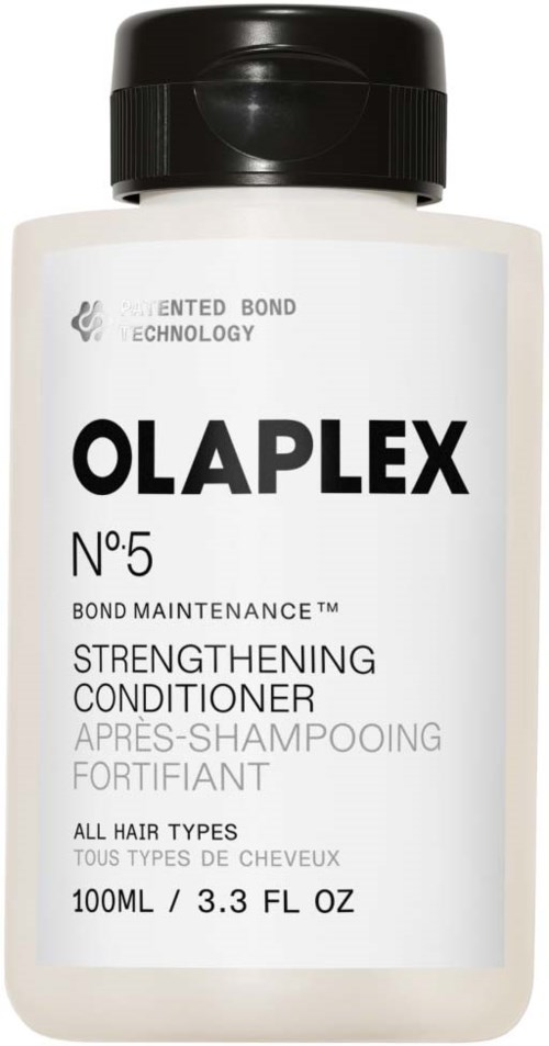 En hvit flaske med Olaplex No.5 Bond Maintenance Strengthening Conditioner med svart lås og etikett.