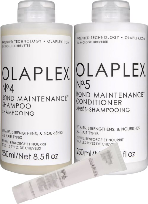 Twee witte flessen Olaplex haarverzorgingsproducten, shampoo en conditioner, met een kleine teststrip voor.