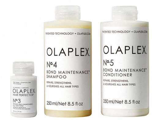 Tre flaskor med Olaplex hårvårdsprodukter: No. 3, No. 4 och No. 5, för att stärka och vårda alla hårtyper.