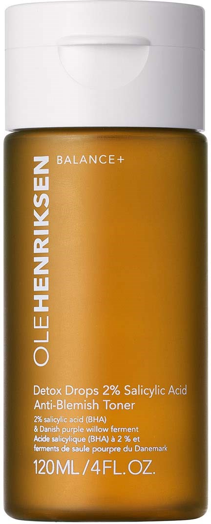 Een kleine bruine fles met een witte dop, gelabeld als olievrije toner met salicylzuur voor huidverzorging.