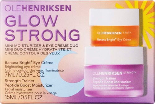 Box with two cream jars, one orange labeled 'Banana Bright Eye' and one pink labeled 'Strength Trainer'.