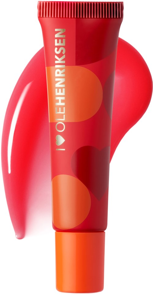 Rode tube met oranje en rode cirkels, tekst 'I love Ole Henriksen' erop, rode achtergrond.