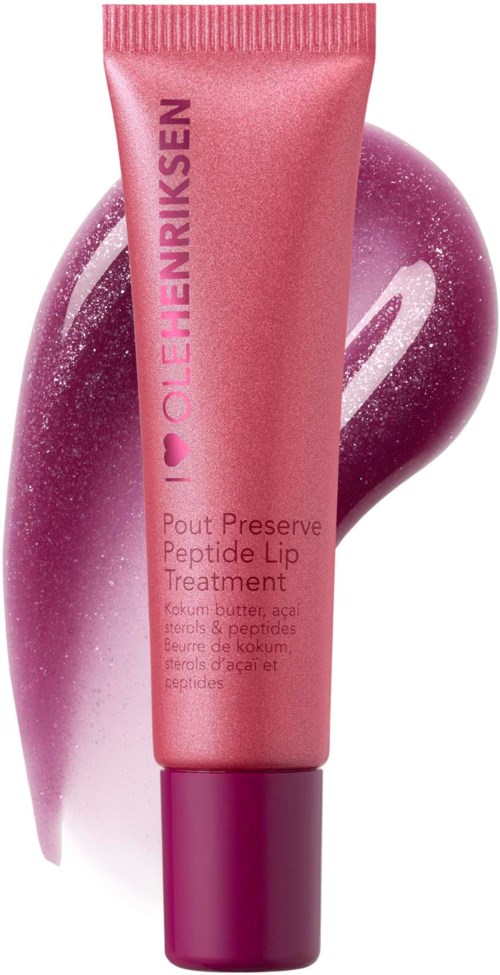 Ein rosa Lippenpflegetube mit lila Kappe, hinter ihr ein Fleck von rosa und lila Creme.