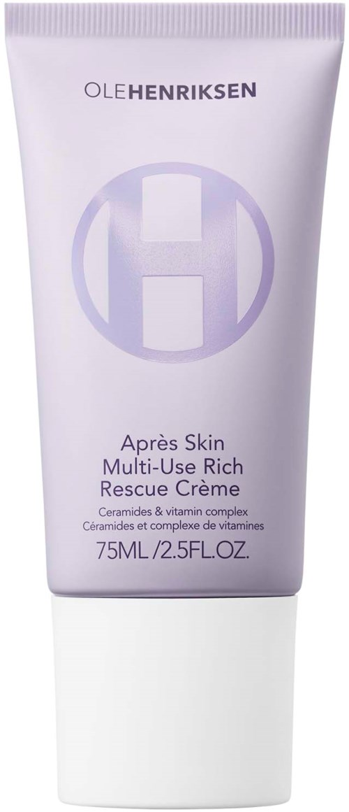 Een witte tube met paarse en grijze tekst, gelabeld 'Oleh Henriksen' en 'Après Skin,' met een huidverzorgingscrème.