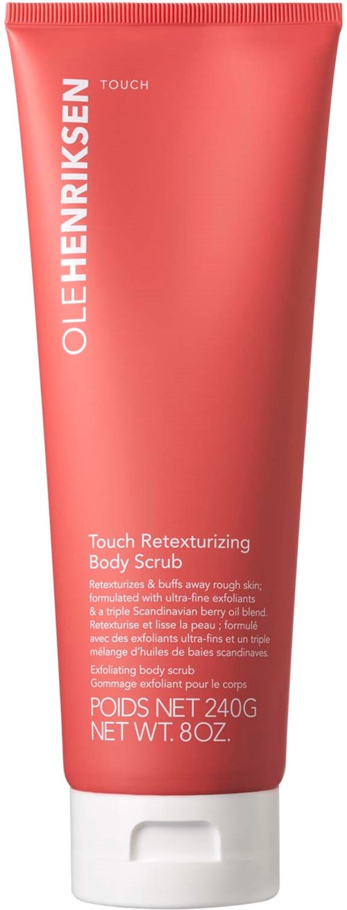 Een koraalroze tube van Ole Henriksen Touch Retexturizing Body Scrub met witte tekst en witte dop.