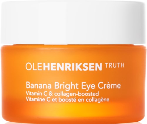 Een potje van Ole Henriksen Banana Bright Eye Crème, oranje container met witte dop, bevordert vitamine C en collageen.