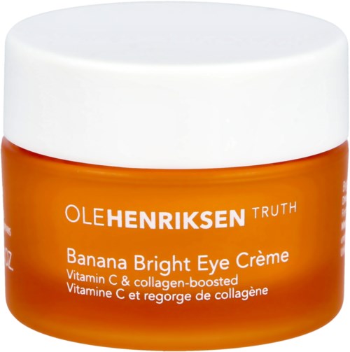 Oranje pot met banaanheldere oogcrème met vitamine C en collageen. Merk Olhenriksen Truth zichtbaar.